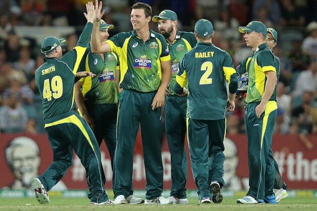 CANBERRA, AUSTRALIA - NOVEMBER 19: Josh Hazlewood of Australia celebrates with team mates after taking the wicket of Hashim Amla of South Africa during game three of the One Day International Series between Australia and South Africa at Manuka Oval on November 19, 2014 in Canberra, Australia.  (Photo by Mark Metcalfe/Getty Images)
