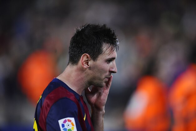 FC Barcelona's Lionel Messi from Argentina reacts during a Spanish La Liga soccer match against Celta de Vigo at the Camp Nou stadium in Barcelona, Spain, Saturday, Nov. 1, 2014. (AP Photo/Manu Fernandez)