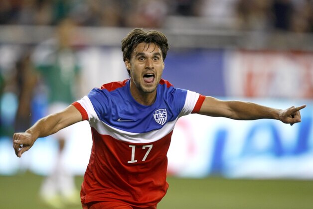 U.S. forward Chris Wondolowski (17) celebrates after scoring a first-half goal against Mexico during an international friendly soccer match Wednesday, April 2, 2014, in Glendale, Ariz. (AP Photo/Rock Scuteri)
