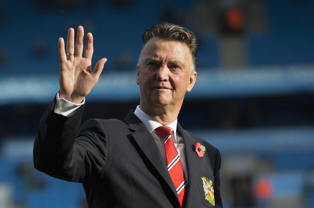 Manchester United's manager Louis van Gaal waves to supporters before his team's English Premier League soccer match against Manchester City at the Etihad Stadium, Manchester, England, Sunday Nov. 2, 2014. (AP Photo/Jon Super)