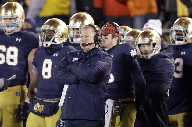 Notre Dame head coach Brian Kelly watches his team in overtime of an NCAA college football game against Northwestern in South Bend, Ind., Saturday, Nov. 15, 2014. Northwestern won 43-40. (AP Photo/Nam Y. Huh)