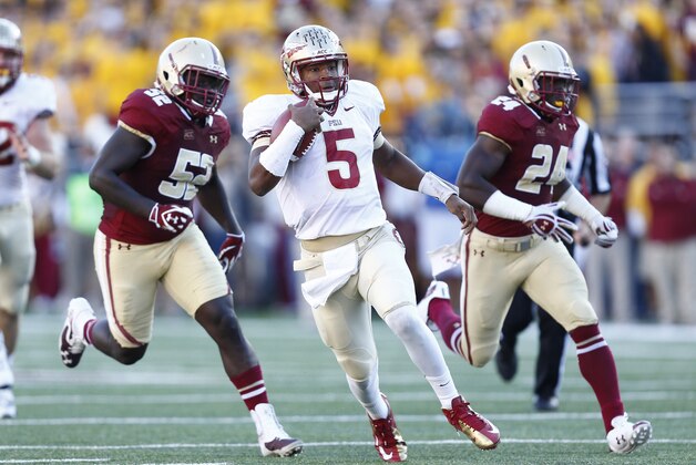 Sep 28, 2013; Boston, MA, USA; Florida State Seminoles quarterback Jameis Winston (5) runs the ball against the Boston College Eagles during the first half at Alumni Stadium. Mandatory Credit: Mark L. Baer-USA TODAY Sports