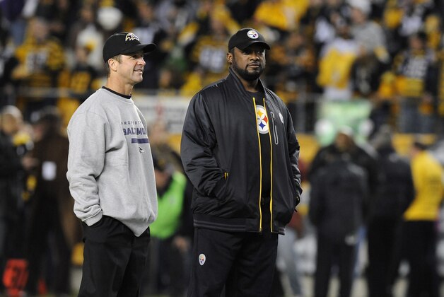 Baltimore Ravens head coach John Harbaugh and Pittsburgh Steelers head coach Mike Tomlin talk before an NFL football game on Sunday, Nov. 18, 2012, in Pittsburgh. (AP Photo/Don Wright)