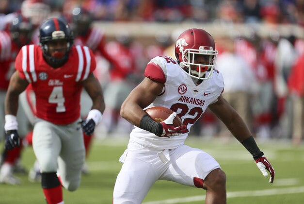 Nov 9, 2013; Oxford, MS, USA; Arkansas Razorbacks running back Jonathan Williams (32) advances the ball during the game against the Mississippi Rebels at Vaught-Hemingway Stadium. Mandatory Credit: Spruce Derden-USA TODAY Sports