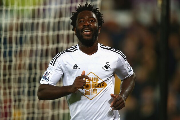 SWANSEA, WALES - OCTOBER 25:  Wilfried Bony of Swansea City celebrates scoring their second goal during the Barclays Premier League match between Swansea City and Leicester City at Liberty Stadium on October 25, 2014 in Swansea, Wales.  (Photo by Clive Rose/Getty Images)