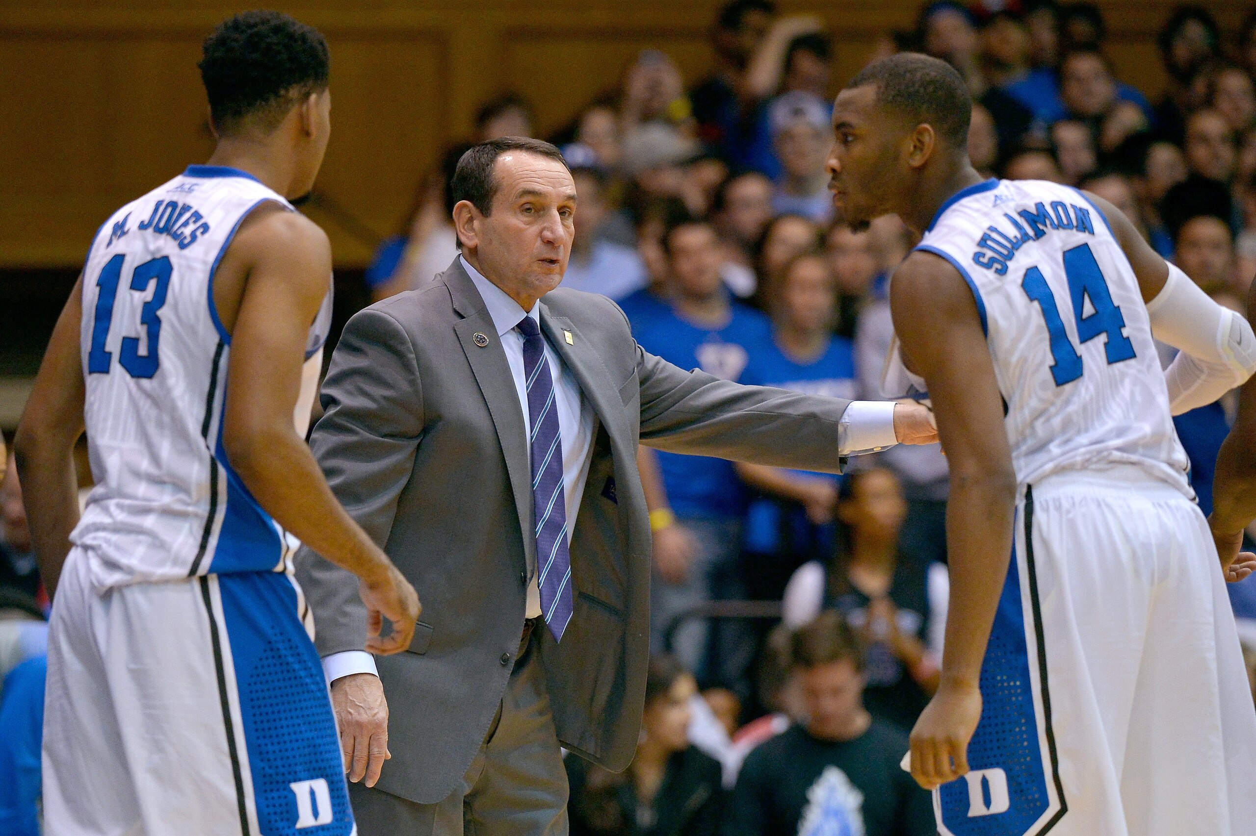 DURHAM, NC - NOVEMBER 14:  Head coach Mike Krzyzewski talks to Matt Jones #13 and Rasheed Sulaimon #14 of the Duke Blue Devils during their game against the Presbyterian Blue Hose at Cameron Indoor Stadium on November 14, 2014 in Durham, North Carolina.  (Photo by Grant Halverson/Getty Images)