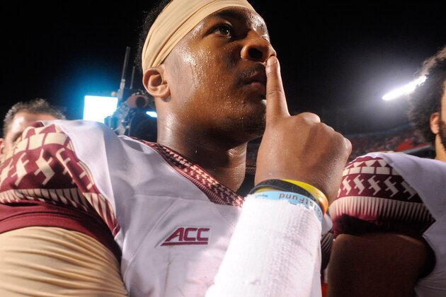 Nov 15, 2014; Miami Gardens, FL, USA; Florida State Seminoles quarterback Jameis Winston (5) gestures to the crowd as the Florida State Seminoles beat the Miami Hurricanes 30-26 at Sun Life Stadium. Mandatory Credit: David Manning-USA TODAY Sports