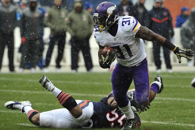 CHICAGO, IL - NOVEMBER 16: Jerick McKinnon #31 of the Minnesota Vikings runs against the Chicago Bears on November 16, 2014 at Soldier Field in Chicago, Illinois.  (Photo by David Banks/Getty Images)