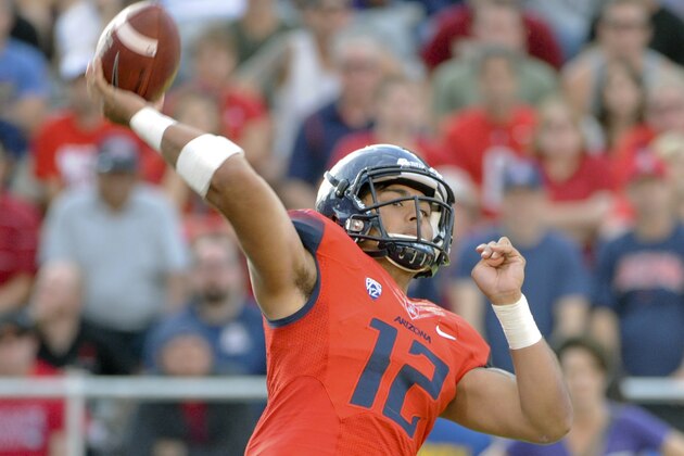 Nov 15, 2014; Tucson, AZ, USA; Arizona Wildcats quarterback Anu Solomon (12) passes the ball during the second half against the Washington Huskies at Arizona Stadium. Arizona won 27-26. Mandatory Credit: Casey Sapio-USA TODAY Sports