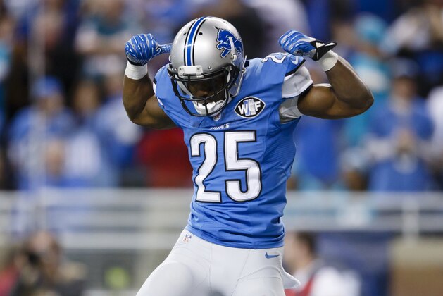 Detroit Lions running back Theo Riddick (25) celebrates after scoring a touchdown against the Miami Dolphins during an NFL football game at Ford Field in Detroit, Sunday, Nov. 9, 2014. (AP Photo/Rick Osentoski)