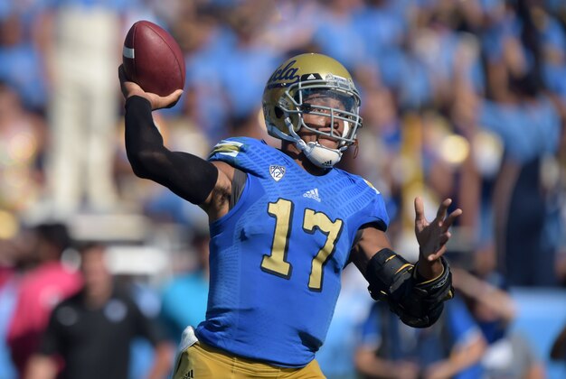 Oct 11, 2014; Pasadena, CA, USA; UCLA Bruins quarterback Brett Hundley (17) throws a pass against the Oregon Ducks at Rose Bowl. Mandatory Credit: Kirby Lee-USA TODAY Sports