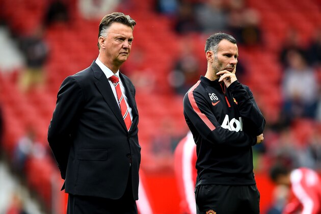 MANCHESTER, ENGLAND - SEPTEMBER 27:  Louis van Gaal the manager of Manchester United and Ryan Giggs the assistant manager of Manchester United look on prior to kickoff during the Barclays Premier League match between Manchester United and West Ham United at Old Trafford on September 27, 2014 in Manchester, England.  (Photo by Laurence Griffiths/Getty Images)