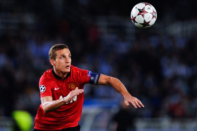 SAN SEBASTIAN, SPAIN - NOVEMBER 05:  Nemanja Vidic of Manchester United clears the ball during the UEFA Champions League Group A match between Real Sociedad de Futbol and Manchester United at Estadio Anoeta on November 5, 2013 in San Sebastian, Spain.  (Photo by David Ramos/Getty Images)