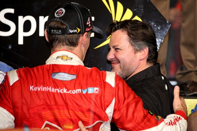 HOMESTEAD, FL - NOVEMBER 16:  Kevin Harvick, driver of the #4 Budweiser Chevrolet, and team owner Tony Stewart celebrate winning in Victory Lane after the NASCAR Sprint Cup Series Ford EcoBoost 400 at Homestead-Miami Speedway on November 16, 2014 in Homestead, Florida.  (Photo by Chris Graythen/Getty Images)