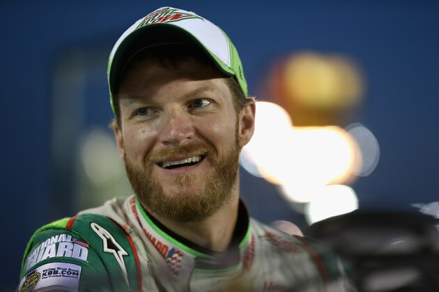 CHARLOTTE, NC - OCTOBER 09:  Dale Earnhardt Jr., driver of the #88 Diet Mountain Dew Chevrolet, looks on from the grid prior to qualifying for the NASCAR Sprint Cup Series Bank of America 500 at Charlotte Motor Speedway on October 9, 2014 in Charlotte, North Carolina.  (Photo by Sarah Glenn/Getty Images)