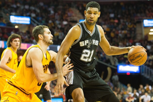 CLEVELAND, OH - NOVEMBER 19:  Kevin Love #0 of the Cleveland Cavaliers puts pressure on Tim Duncan #21 of the San Antonio Spurs during the first half at Quicken Loans Arena on November 19, 2014 in Cleveland, Ohio. User expressly acknowledges and agrees that, by downloading and or using this photograph, User is consenting to the terms and conditions of the Getty Images License Agreement. (Photo by Jason Miller/Getty Images)