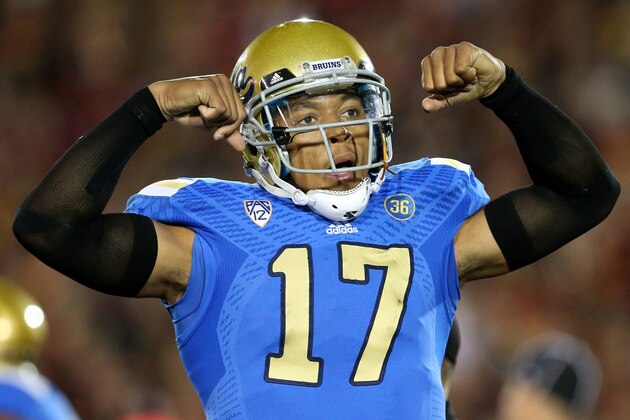 LOS ANGELES, CA - NOVEMBER 30:  Quarterback Brett Hundley #17 of the UCLA Bruins flexes as he celebrates a Myles Jack three yard touchdown run in the first quarter against the USC Trojans at Los Angeles Coliseum on November 30, 2013 in Los Angeles, California.  (Photo by Stephen Dunn/Getty Images)