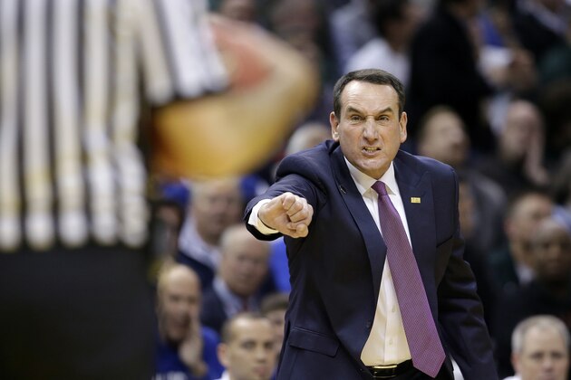 Duke head coach Mike Krzyzewski argues a call during the first half of an NCAA college basketball game against the Michigan State, Tuesday, Nov. 18, 2014, in Indianapolis.  (AP Photo/Darron Cummings)