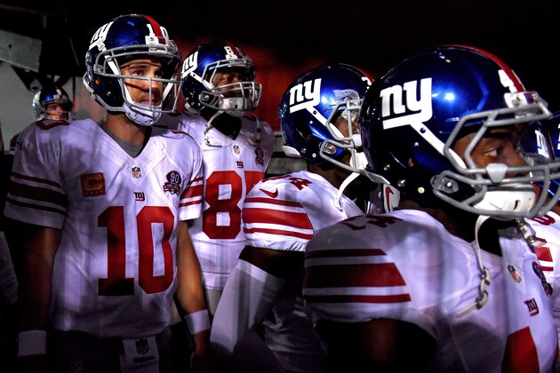 LANDOVER, MD - SEPTEMBER 25: Quarterback Eli Manning #10 of the New York Giants walks out of the tunnel before playing the Washington Redskins at FedExField on September 25, 2014 in Landover, Maryland. (Photo by Patrick Smith/Getty Images)
