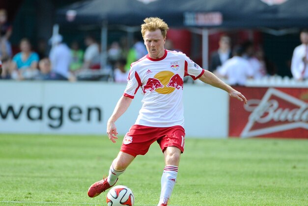 Aug 31, 2014; Washington, DC, USA; New York Red Bulls midfielder Dax McCarty (11) shoots the ball against the D.C. United during the second half at Robert F. Kennedy Memorial. Mandatory Credit: Brad Mills-USA TODAY Sports