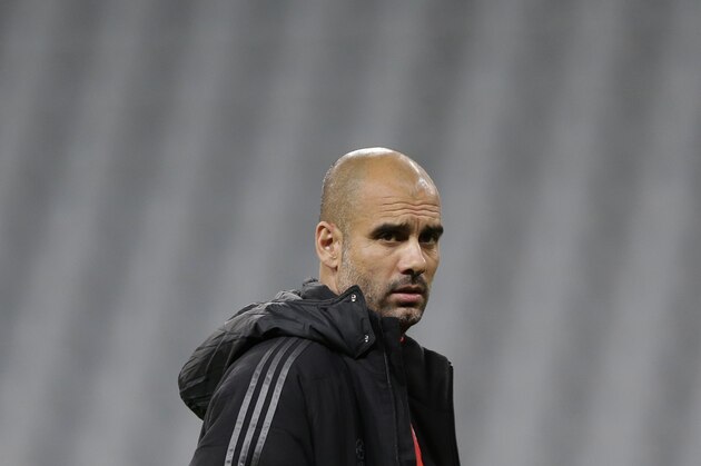 Bayern's head coach Pep Guardiola of Spain attends a training session prior to the Champions League Group E soccer match between FC Bayern Munich and AS Roma at Allianz Arena in Munich, southern Germany, Tuesday Nov. 4, 2014. Bayern Munich will face Roma on Wednesday. (AP Photo/Matthias Schrader)