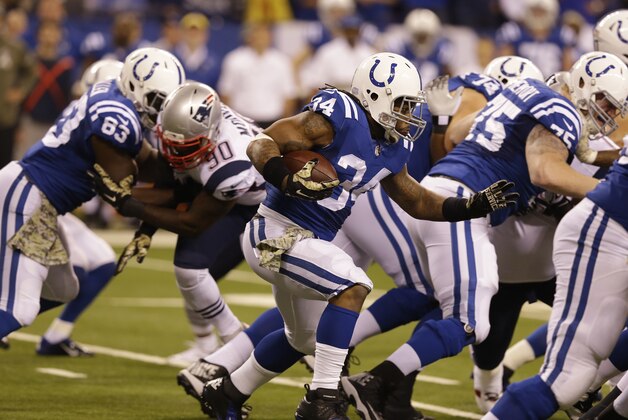 Indianapolis Colts running back Trent Richardson runs against the New England Patriots during the first half of an NFL football game in Indianapolis, Sunday, Nov. 16, 2014. (AP Photo/Michael Conroy)