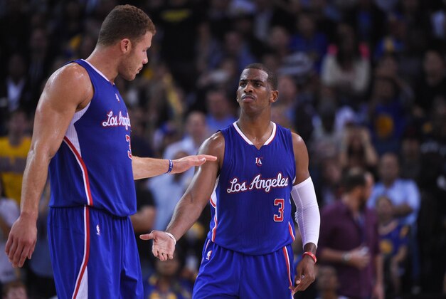 November 5, 2014; Oakland, CA, USA; Los Angeles Clippers forward Blake Griffin (32, left) and guard Chris Paul (3) high-five during the third quarter against the Golden State Warriors at Oracle Arena. The Warriors defeated the Clippers 121-104. Mandatory Credit: Kyle Terada-USA TODAY Sports