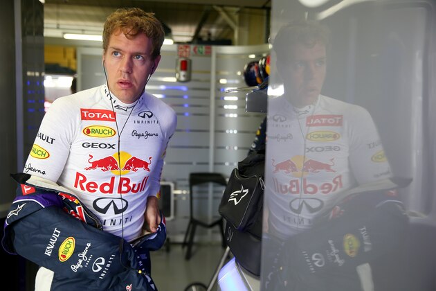 SAO PAULO, BRAZIL - NOVEMBER 09:  Sebastian Vettel of Germany and Infiniti Red Bull Racing prepares in the garage before the Brazilian Formula One Grand Prix at Autodromo Jose Carlos Pace on November 9, 2014 in Sao Paulo, Brazil.  (Photo by Mark Thompson/Getty Images)