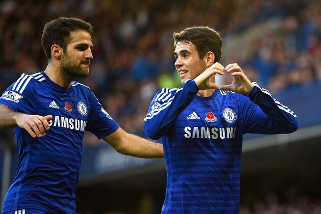 LONDON, ENGLAND - NOVEMBER 01:  Oscar of Chelsea celebrates his goal with Cesc Fabregas during the Barclays Premier League match between Chelsea and Queens Park Rangers at Stamford Bridge on November 1, 2014 in London, England.  (Photo by Mike Hewitt/Getty Images)