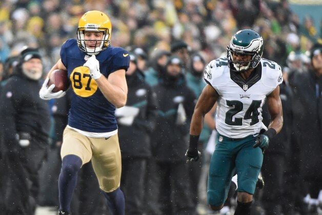 Nov 16, 2014; Green Bay, WI, USA;  Green Bay Packers wide receiver Jordy Nelson (87) runs past Philadelphia Eagles cornerback Bradley Fletcher (24) after catching a pass for a 64-yard gain in the first quarter at Lambeau Field. Mandatory Credit: Benny Sieu-USA TODAY Sports