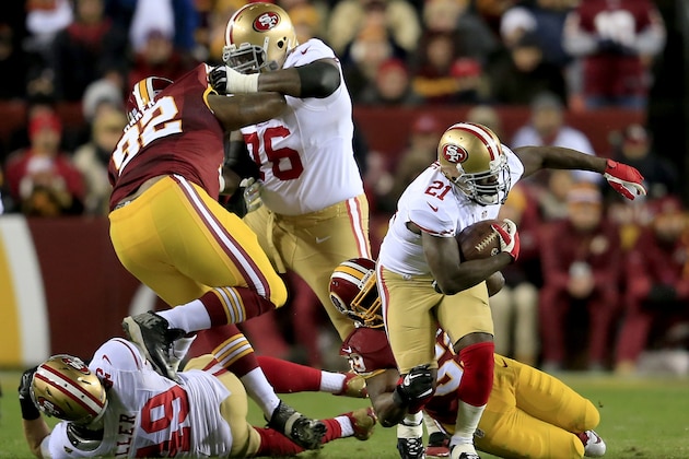 LANDOVER, MD - NOVEMBER 25:  Running back Frank Gore #21 of the San Francisco 49ers runs the ball against inside linebacker London Fletcher #59 of the Washington Redskins in the first quarter at FedExField on November 25, 2013 in Landover, Maryland.  (Photo by Rob Carr/Getty Images)