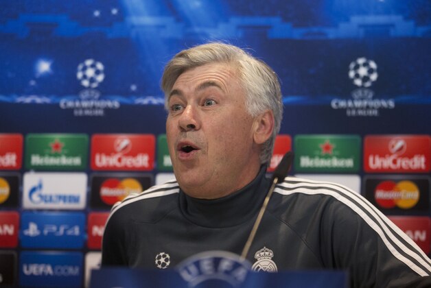 Real Madrid's coach Carlo Ancelotti reacts at the start of a press conference in Madrid, Spain, Monday Nov. 3, 2014. Real Madrid will play Liverpool on Tuesday in a Group B Champions League soccer match. (AP Photo/Paul White)