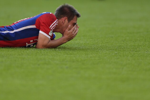Bayern's Philipp Lahm lies on the ground during the German first division Bundesliga soccer match between FC Bayern and SV Werder Bremen in the Allianz Arena in Munich, Germany, on Saturday, Oct. 18, 2014. (AP Photo/Matthias Schrader)