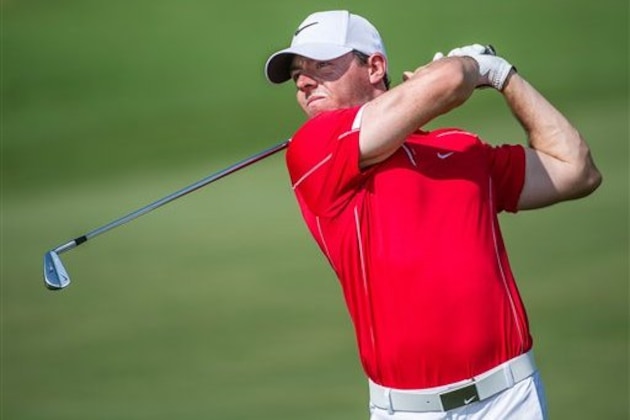 Rory McIlroy of Northern Ireland plays an approach shot on the 3rd fairway, during the first day of The DP World Tour Championship, held at Jumeirah Golf Estates in Dubai, United Arab Emirates, on Thursday,  Nov. 20, 2014. (AP Photo/Stephen Hindley)