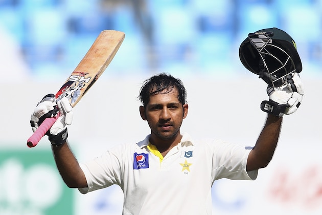 DUBAI, UNITED ARAB EMIRATES - NOVEMBER 20:  Sarfraz Ahmed of Pakistan celebrates after reaching his century during day four of the second test between Pakistan and New Zealand at Dubai International Stadium on November 20, 2014 in Dubai, United Arab Emirates.  (Photo by Francois Nel/Getty Images)