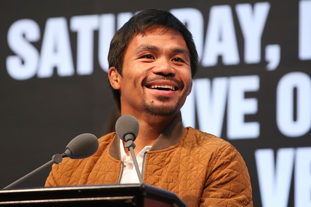 MACAU - NOVEMBER 19:  Manny Pacquiao speaks to media about the upcoming fight against Chris Algieri during a press conference at The Venetian on November 19, 2014 in Macau, Macau.  (Photo by Chris Hyde/Getty Images)