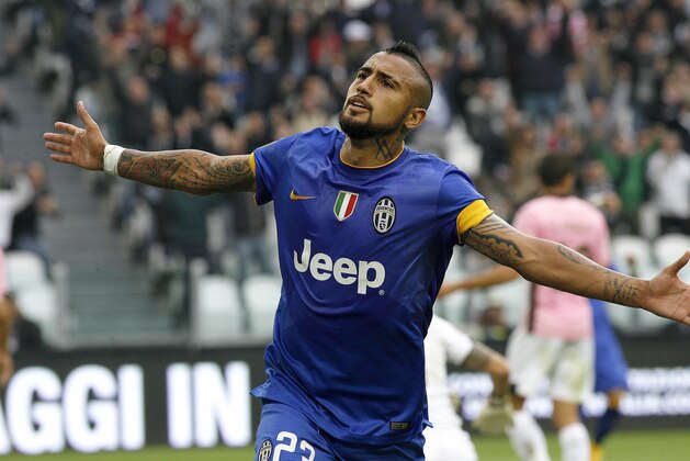 Juventus' Arturo Vidal celebrates after scoring during a Serie A soccer match between Juventus and  Palermo at the Juventus stadium, in Turin, Italy, Sunday, Oct. 26, 2014. (AP Photo/Massimo Pinca)