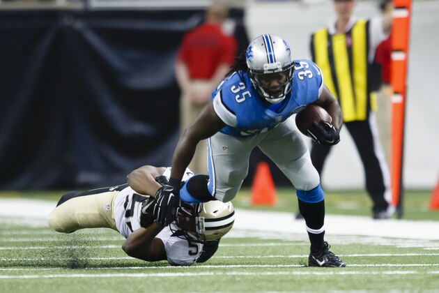 Detroit Lions running back Joique Bell (35) breaks a tackle by New Orleans Saints inside linebacker Ramon Humber (53) during an NFL football game at Ford Field in Detroit, Sunday, Oct. 19, 2014. (AP Photo/Rick Osentoski)