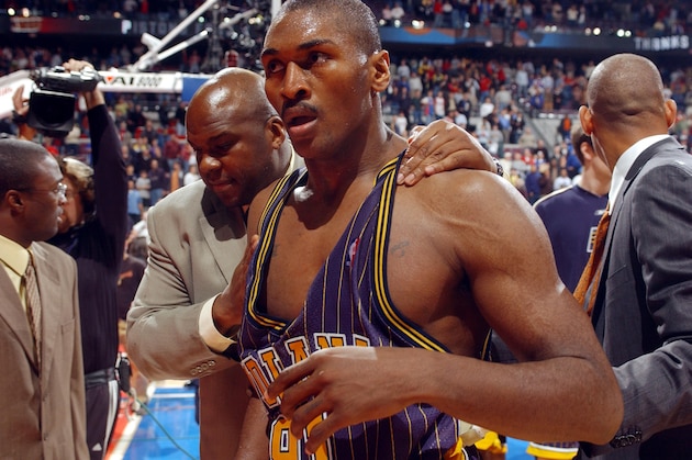 AUBURN HILLS, MI - NOVEMBER 19:  Ron Artest of the Indiana Pacers #91 leaves the floor after a melee involving fans during a game against the Detroit Pistons November 19, 2004 at the Palace of Auburn Hills, in Auburn Hills, Michigan.  NOTE TO USER: User expressly acknowledges and agrees that, by downloading and/or using this Photograph, User is consenting to the terms and conditions of the Getty Images License Agreement. Copyright 2004 NBAE  (Photo by Allen Einstein/NBAE via Getty Images)