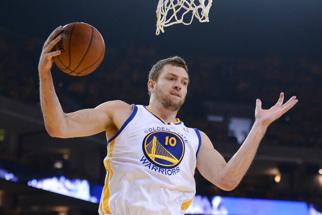 Apr 27, 2014; Oakland, CA, USA; Golden State Warriors forward David Lee (10) grabs a rebound during the first quarter in game four of the first round of the 2014 NBA Playoffs against the Los Angeles Clippers at Oracle Arena. The Warriors defeated the Clippers 118-97.  Mandatory Credit: Kyle Terada-USA TODAY Sports