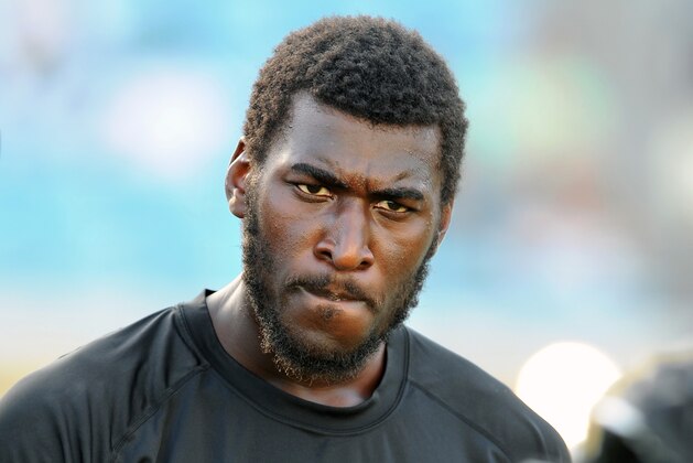 FILE - In this Aug. 9, 2013 file photo, Jacksonville Jaguars wide receiver Justin Blackmon speaks with a teammate during warmups before an NFL preseason football game against the Miami Dolphins, in Jacksonville, Fla. Blackmon was suspended for the rest of the season Friday, Nov. 1, 2013, for another violation of the NFL's substance-abuse policy.  (AP Photo/Stephen Morton, File)