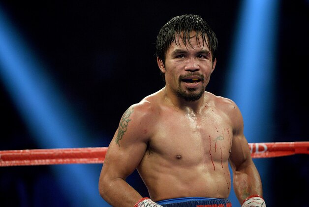 Apr 12, 2014; Las Vegas, NV, USA; Manny Pacquiao during his WBO World Welterweight Championship fight against Timothy Bradley Jr. (not pictured) at the MGM Grand Garden Arena. Manny Pacquiao won by decision. Mandatory Credit: Jayne Kamin-Oncea-USA TODAY Sports