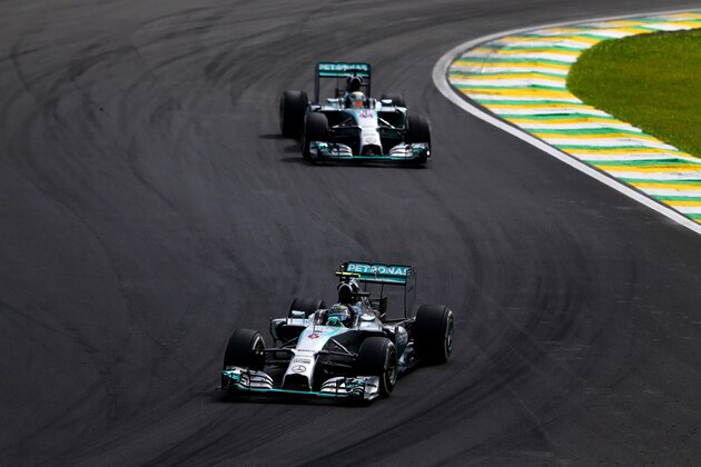 SAO PAULO, BRAZIL - NOVEMBER 09:  Nico Rosberg of Germany and Mercedes GP leads Lewis Hamilton of Great Britain and Mercedes GP during the Brazilian Formula One Grand Prix at Autodromo Jose Carlos Pace on November 9, 2014 in Sao Paulo, Brazil.  (Photo by Dan Istitene/Getty Images)