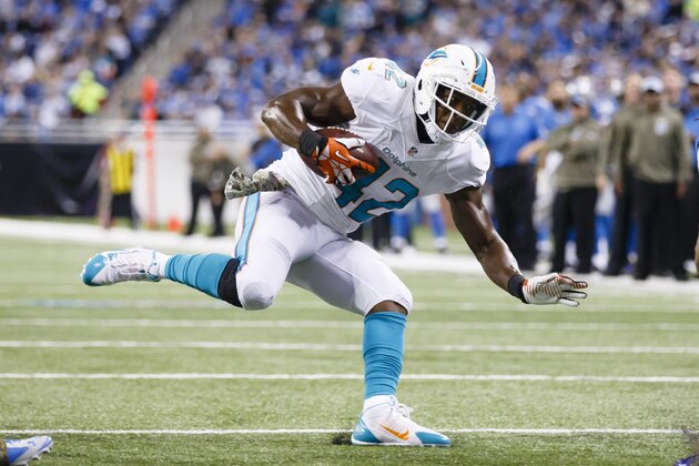 Miami Dolphins tight end Charles Clay (42) rushes against the Detroit Lions during an NFL football game at Ford Field in Detroit, Sunday, Nov. 9, 2014. (AP Photo/Rick Osentoski)