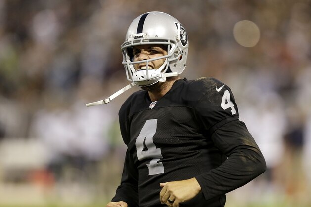 Oakland Raiders quarterback Derek Carr (4) against the Seattle Seahawks during the first half of an NFL preseason football game in Oakland, Calif., Thursday, Aug. 28, 2014. (AP Photo/Ben Margot)