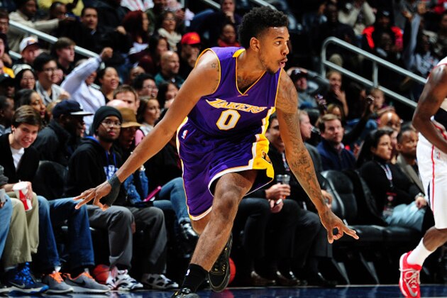 ATLANTA, GA - NOVEMBER 18: Nick Young #0 of the Los Angeles Lakers celebrates after scoring against the Atlanta Hawks on November 18, 2014 at Philips Arena in Atlanta, Georgia.  NOTE TO USER: User expressly acknowledges and agrees that, by downloading and/or using this Photograph, user is consenting to the terms and conditions of the Getty Images License Agreement. Mandatory Copyright Notice: Copyright 2014 NBAE (Photo by Scott Cunningham/NBAE via Getty Images)
