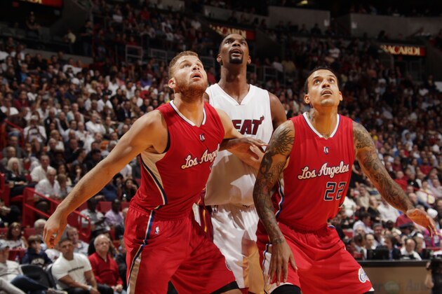 MIAMI, FL - November 20: Blake Griffin #32, Matt Barnes #22 of the Los Angeles Clippers look up for the rebound against Chris Bosh #1 of the Miami Heat during the game at the American Airlines Arena in Miami, Florida on November 20, 2014. NOTE TO USER: User expressly acknowledges and agrees that, by downloading and/or using this photograph, user is consenting to the terms and conditions of the Getty Images License Agreement. Mandatory copyright notice: Copyright NBAE 2014 (Photo by Issac Baldizon/NBAE via Getty Images)