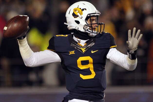 MORGANTOWN, WV - NOVEMBER 20:  Clint Trickett #9 of the West Virginia Mountaineers drops back to pass in the first half against the Kansas State Wildcats during the game on November 20, 2014 at Mountaineer Field in Morgantown, West Virginia.  (Photo by Justin K. Aller/Getty Images)