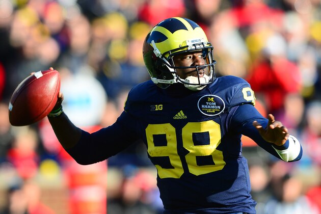 Nov 30, 2013; Ann Arbor, MI, USA; Michigan Wolverines quarterback Devin Gardner (98) looks to pass during the third quarter against the Ohio State Buckeyes at Michigan Stadium. Mandatory Credit: Andrew Weber-USA TODAY Sports