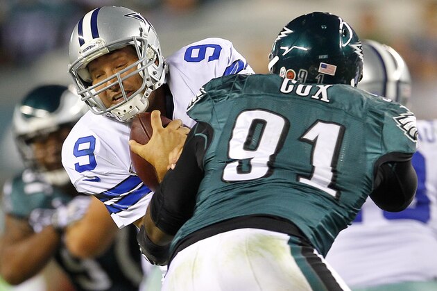 PHILADELPHIA, PA - NOVEMBER 11: Quarterback Tony Romo #9 of the Dallas Cowboys is grabbed by Fletcher Cox #91 of the Philadelphia Eagles but escapes to complete a pass during the third quarter in a game at Lincoln Financial Field on November 11, 2012 in Philadelphia, Pennsylvania. The Cowboys defeated the Eagles 38-23. (Photo by Rich Schultz /Getty Images)